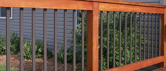 a wood deck railing with Deckorators Traditional Face-Mount Aluminum Balusters