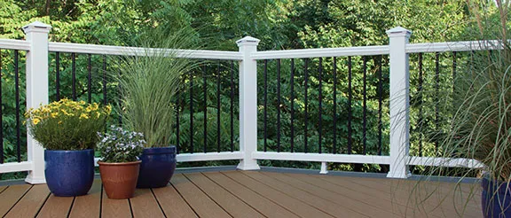 a deck featuring Trex Transcend railing in white with black aluminum balusters