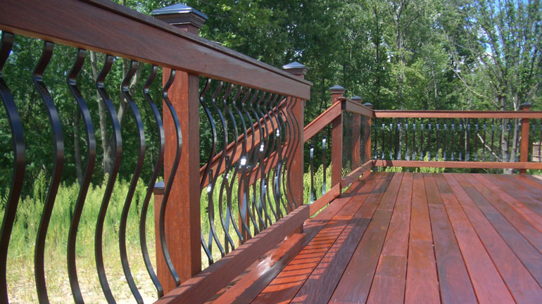 Baroque Architectural Face-Mount Aluminum Balusters installed on wood rails.