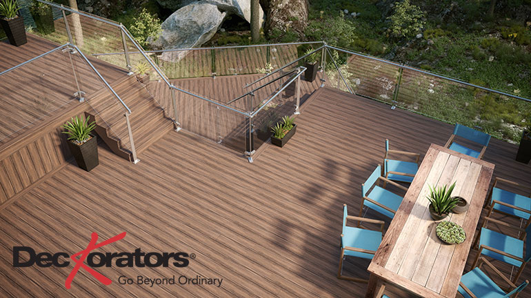 Highlight your gorgeous multi-level deck with Deckorators Voyage decking in Mesa and InvisiRail Glass Railings for a clear view.