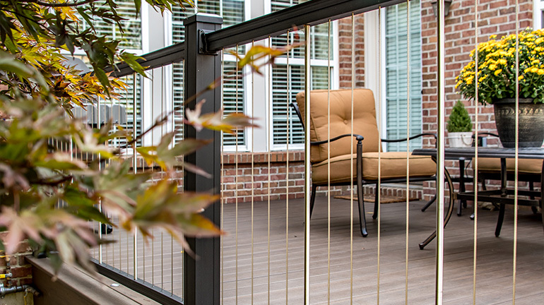 Low-maintenance vertical cable railing offers the benefits of a stylish cable railing system.