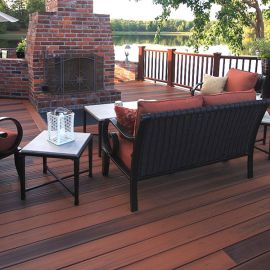Unify your outdoor space by matching your Barrette MVP Grooved Edge Deck Boards, shown in Brazilian Cherry, with your furniture. 