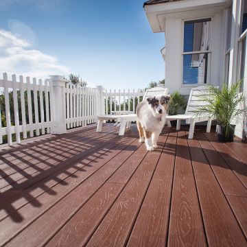 Pets can roam worry-free on the tough capstock of the Envision Expression decking line, shown in Canyon Ridge.