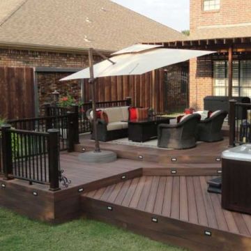The beautiful warmth of Fiberon Concordia Horizon composite decking and riser boards help expand your living room outdoors.