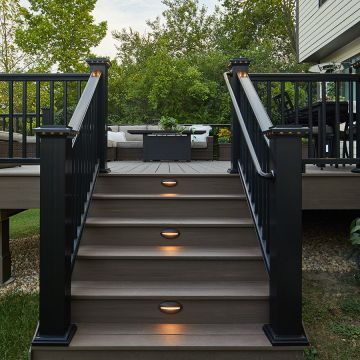 Finish your deck with premium TimberTech Advanced PVC Landmark Fascia Boards, shown in America Walnut