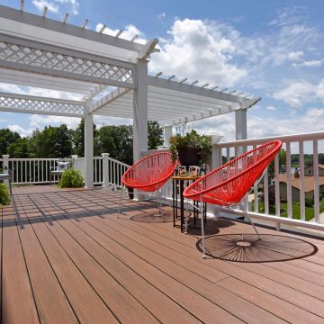 Make caring for your deck as easy as getting a tan with virtually maintenance-free TimberTech Advanced PVC Vintage decking, shown in Mahogany.