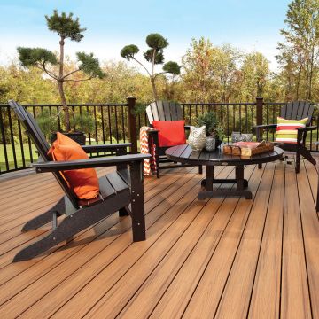 Accent your furniture, railing and open space with Trex Transcend in Tiki Torch, here with Trex Signature Railing in Charcoal Black.