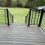 Trex Transcend Lineage Stair Panel installed providing full railing around deck stairs