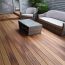 The smooth, unblemished surface of Barrette Siesta Grooved Edge Deck Boards, in Golden Teak, invites barefoot relaxation.