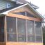 A woodsy porch with large SCREENEZE screen panels