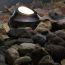 Concealed within the stones of your landscape the Well Pathway Light, shown in Dark Copper Vein, can help illuminate pathways.