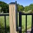 The Trident Magnetic Pool Latch installed on a wood post and metal gate