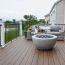Create a relaxing environment for the ones you love with TimberTech Reserve decking, featuring Dark Roast.