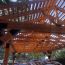 A LINX pergola with extra wood added to the top for a beautiful, rustic roof