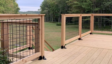 Wild Hog Railing panels are created with wooden railing.