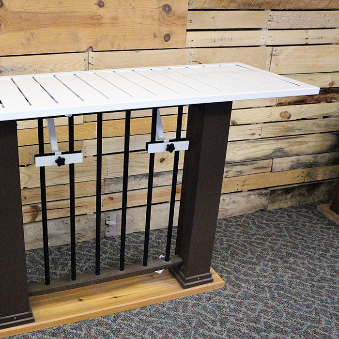 Deckorators Deck Rail Table in White installed on sample deck railing in DecksDirect's Showroom