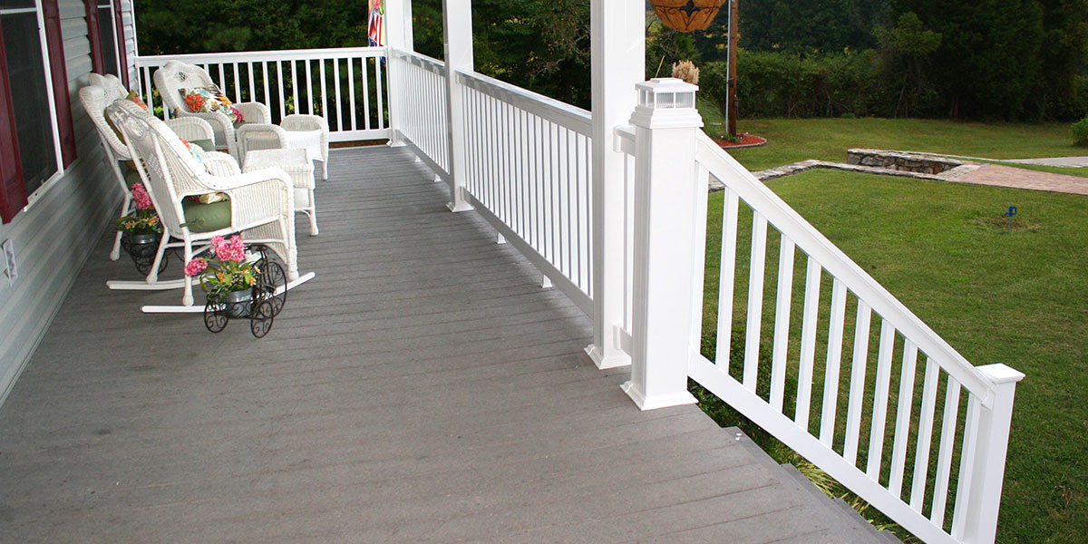 Stately Durables Vinyl Railing in sharp white on an inviting front porch