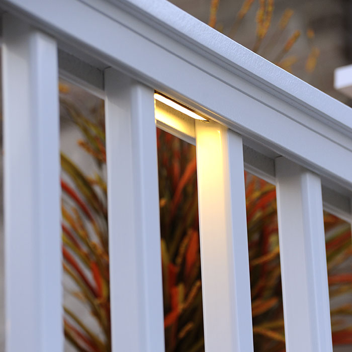 Close up of AZEK TimberTech Under Rail LED Light on a white railing