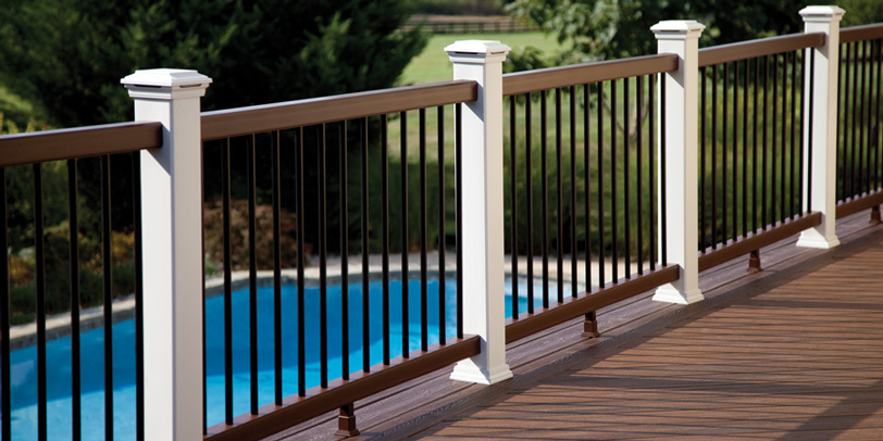 An assembled Trex Transcend composite deck railing overlooking a gorgeous pool