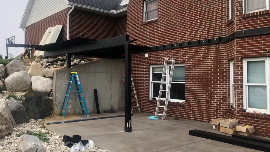 Steel deck framing attached to a brick exterior