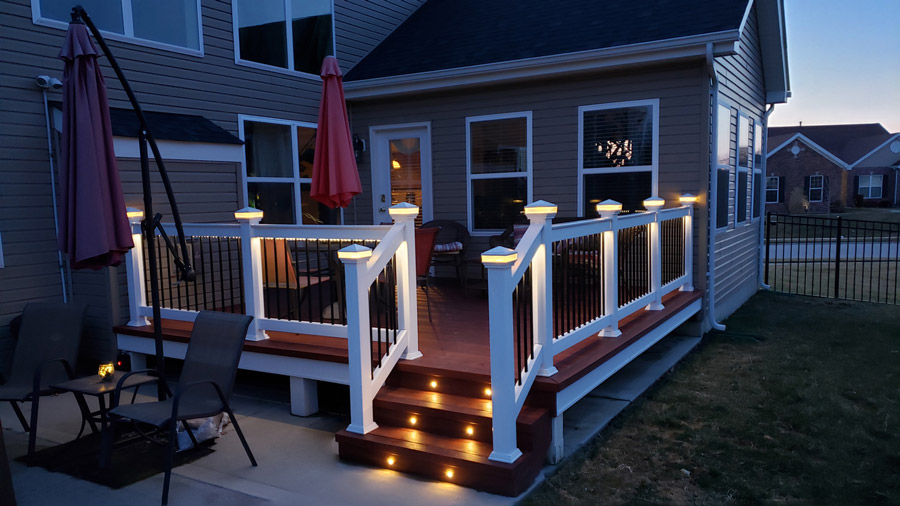 Lighted post caps by LMT Mercer brighten up a deck at night