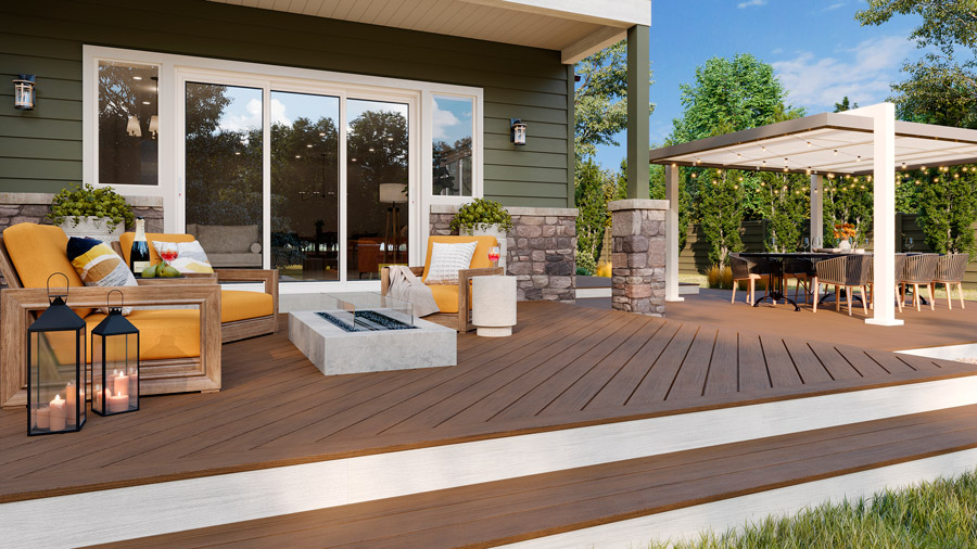 A cozy green house with a soft, brown deck made from Trex Transcend Lineage Jasper deck boards