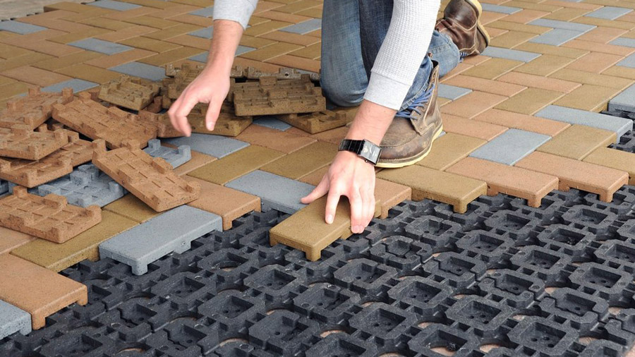 Rectangular pavers installing into a dimpled grid