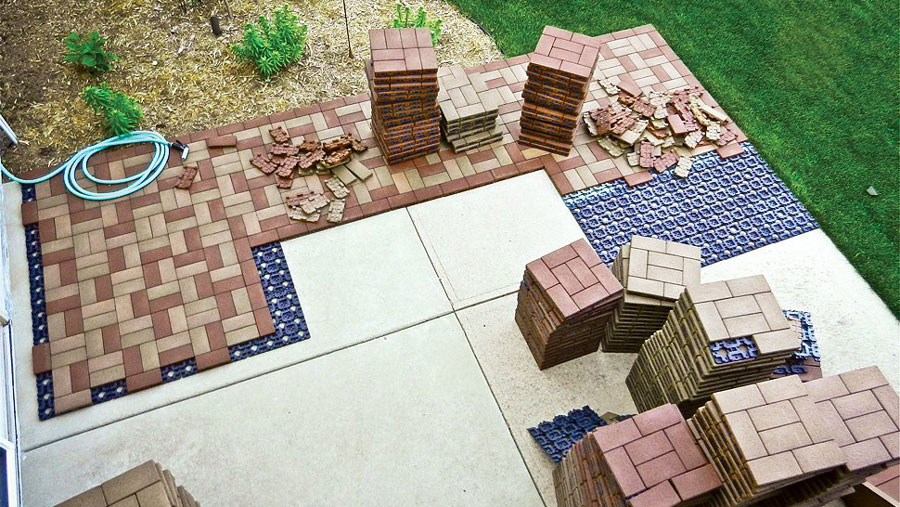 An aerial view of pavers resurfacing over a concrete patio