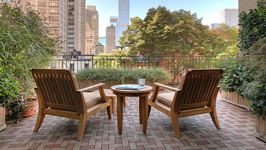 A beautiful rooftop deck with a view of the city, created from Aspire Pavers