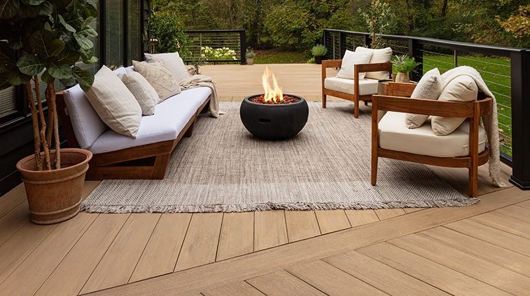 The right decking fulfills your specific dream deck, like this welcoming, modern deck in TimberTech AZEK Vintage's Weathered Teak