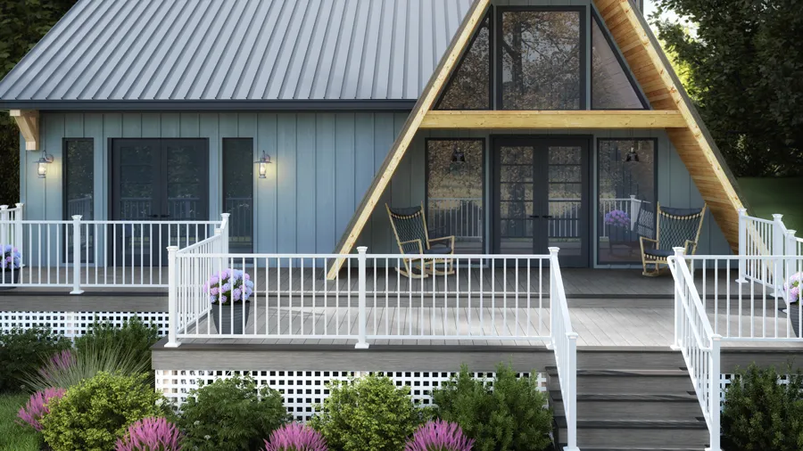 A gorgeous A-Frame home with a white Deckorators railing on the deck