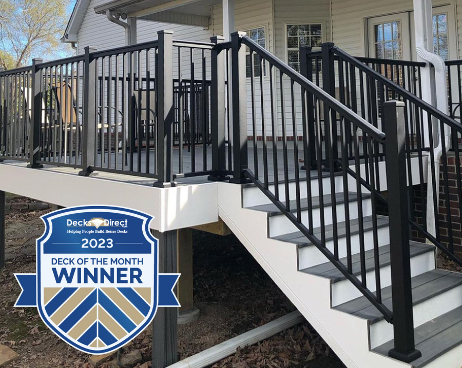 The April 2023 DecksDirect Deck of the Month winner with stylish white fascia trim, gray Trex deck boards, and polished black aluminum AFCO Pro railing