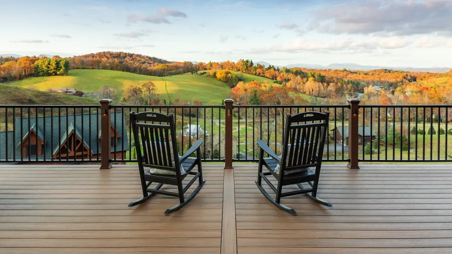 A Trex deck with rocking chairs overlooking the fall colors