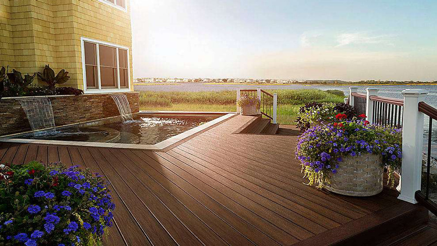 The rich brown finish of Trex Transcend deck boards glinting in the sun