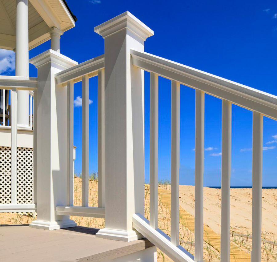 A stylish white TimberTech composite deck railing in a bright, sunny climate