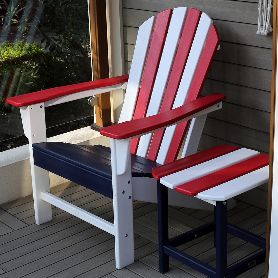 A patriotic Adirondack deck chair sporting the red, white, and blue
