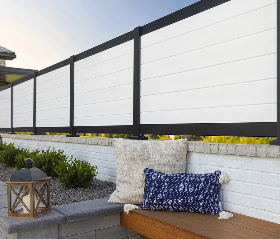 A private backyard with privacy panels making the space cozy