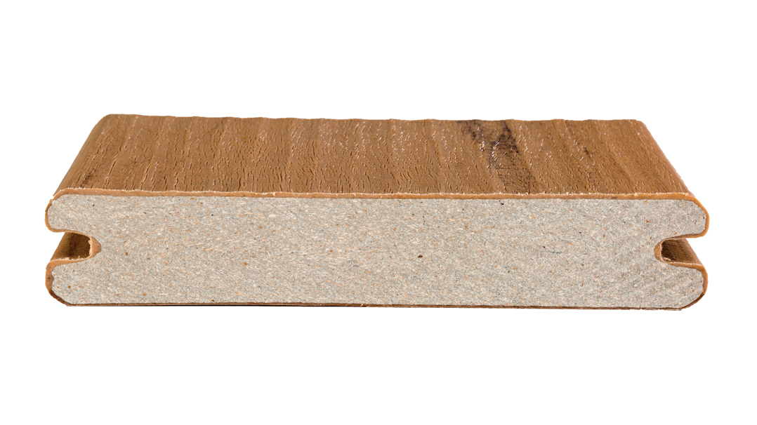 A cross-section of a capped composite deck board