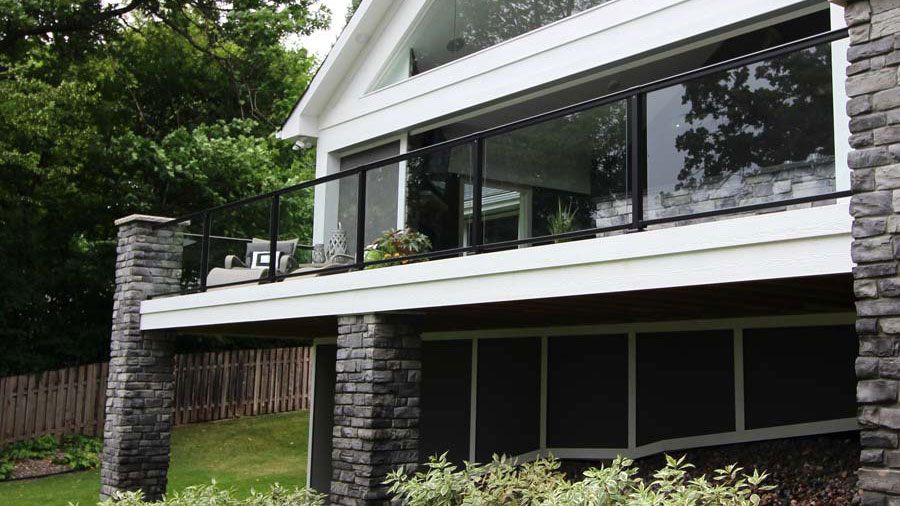 A luxurious deck with modern black glass railing