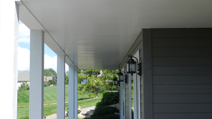 Bright spring light reflects off the smooth surface of UpSide underdeck drainage panels