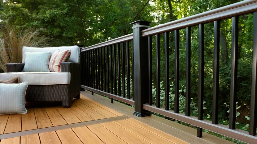A modern black and brown deck railing using the TimberTech Classic Composite Series