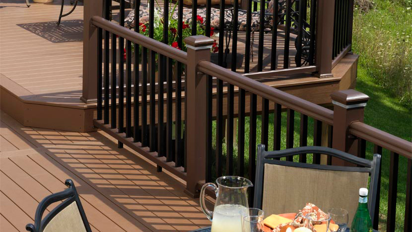 The trim profile of TimberTech's RadianceRail Express railing in brown and black
