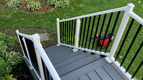Deck stairs with classic metal railing