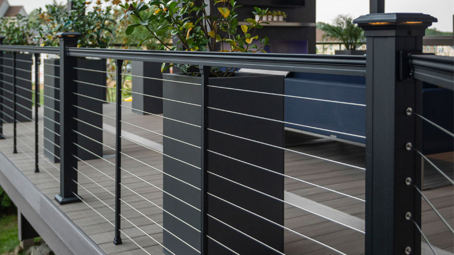 A long section of Key-Link cable deck railing on a large, modern deck