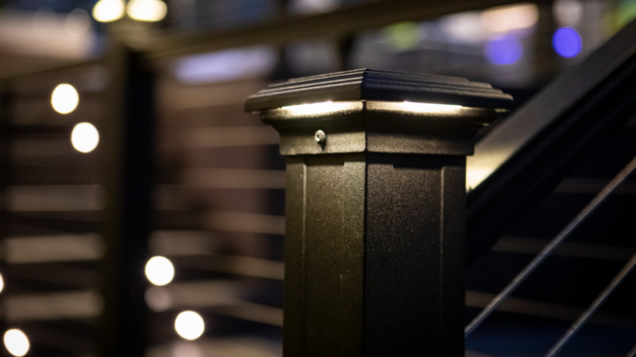 A close-up of a Key-Link lighted post cap as part of a gorgeous lighting setup