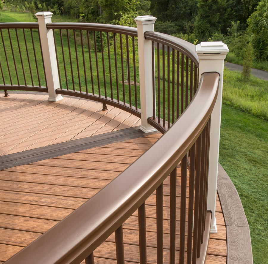 A deck with a curved composite deck railing