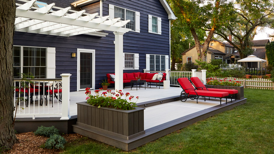 A high-contrast black-and-white deck goes perfectly with a modern farmhouse style home
