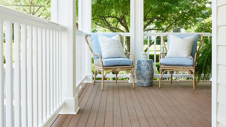 White columns create a cozy modern farmhouse porch look