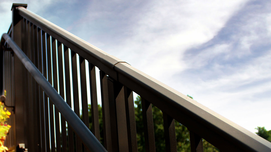 The matte finish of an AFCO Pro deck railing, catching the light without reflecting it