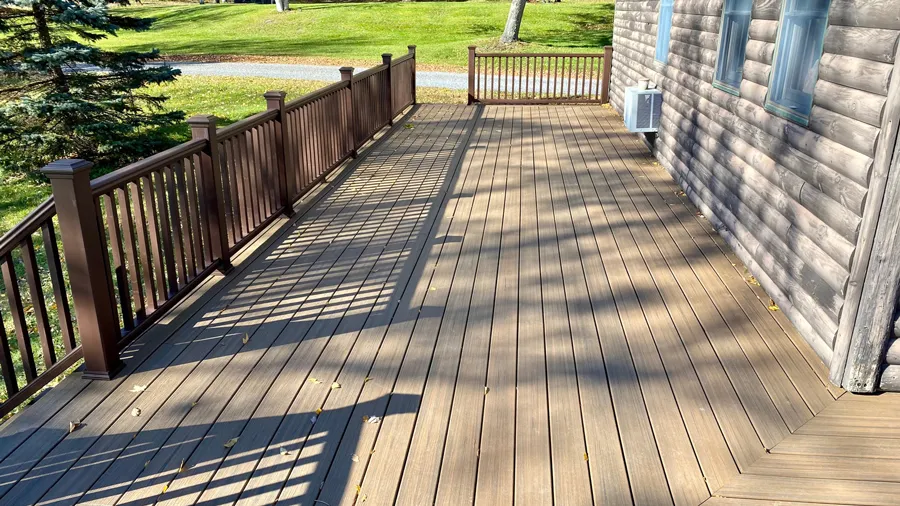 A woodsy cabin deck with Trex Enhance Naturals composite deck boards